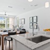 kitchen with an island, modern appliances and spacious counter-space