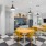 a spacious lounge and kitchen with yellow chairs